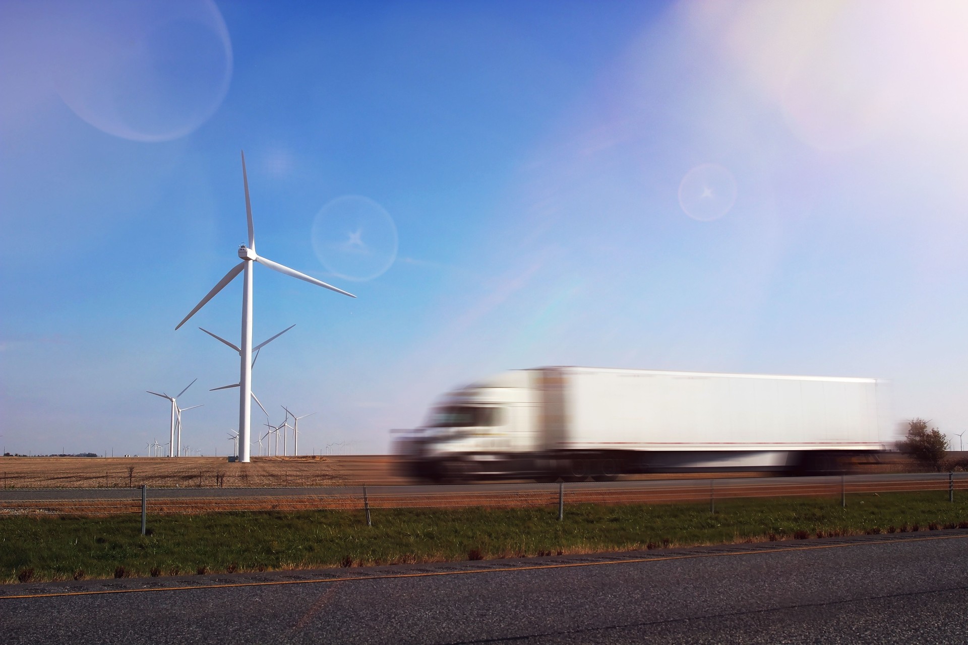 Wind Turbines with a truck on a road