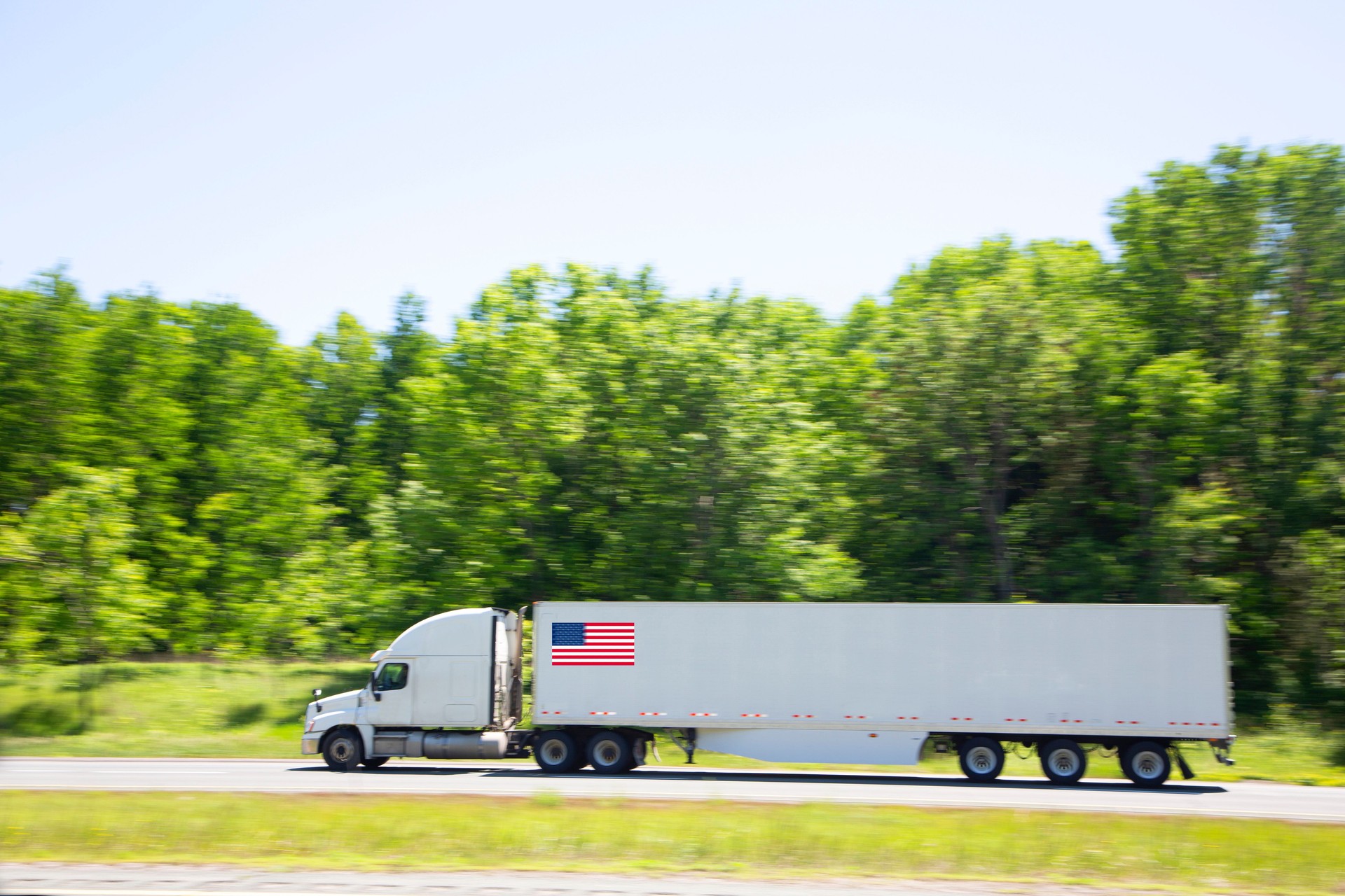 Semi trailer truck with USA flag
